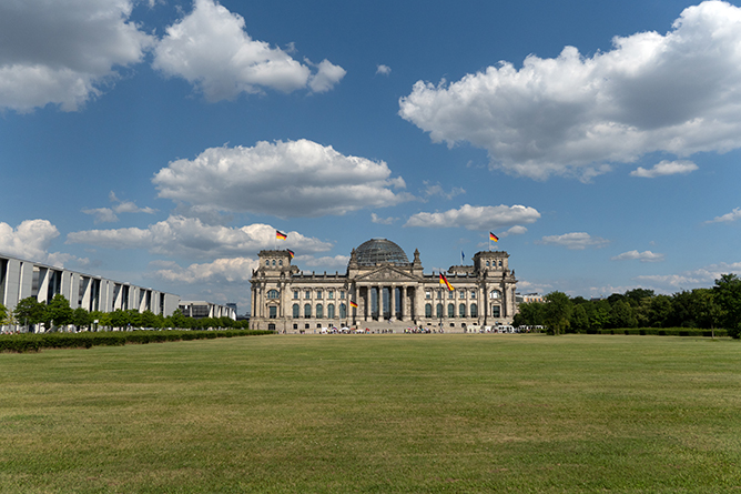 Photo of a Large Building with a Spacious Lawn in Front Shot by Tamron 18-300mm F3.5-6.3