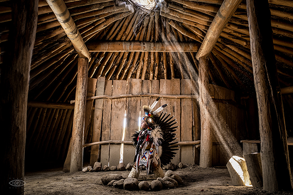 One of the tribe's youngest dancers posing inside the tribal earth lodge