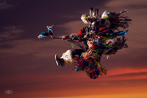 Tribal dancer jumping in air