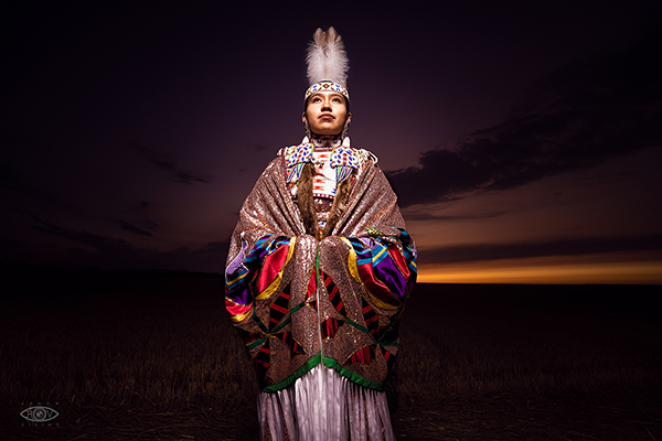 Tribal dancer with tall feather plume