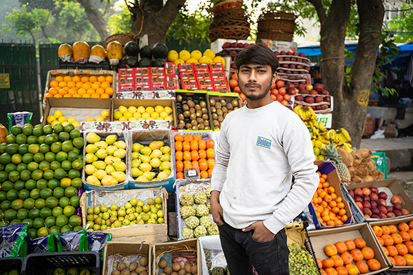 Man standing in front of fruit market