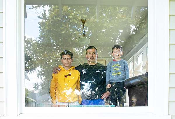 Family of three in window