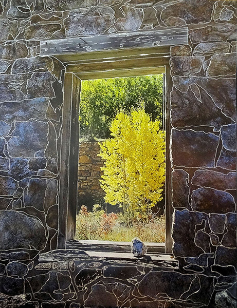 Stone wall with window - stone wall has detailed outline around stones with a yellow tree visible through the window
