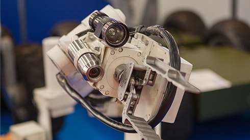 Compact and lightweight optical devices installed with robot arm